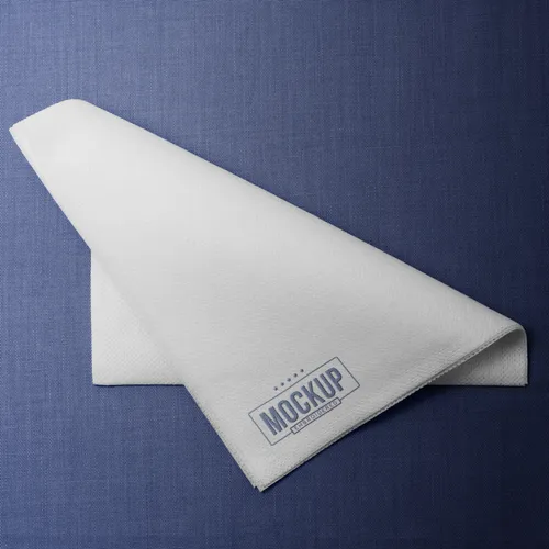 Napkin on blue background top view