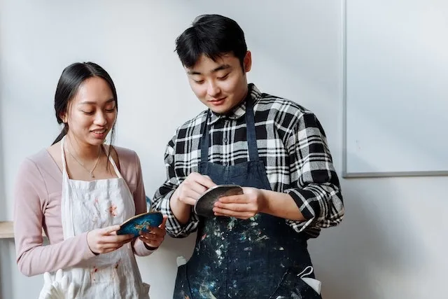 Man and woman admiring home made coasters for how to make tea coaster