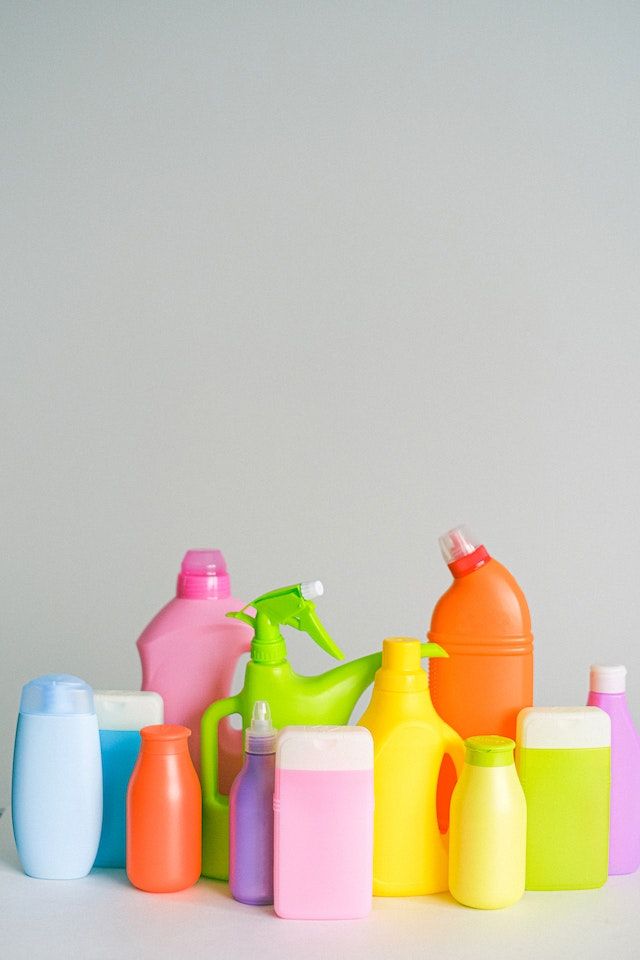 Photograph of generic cleaning products in bottles for how to clean a neon sign.