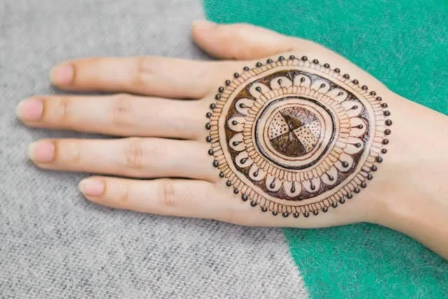 a henna tattoo on a hand for custom temporary tattoos long lasting