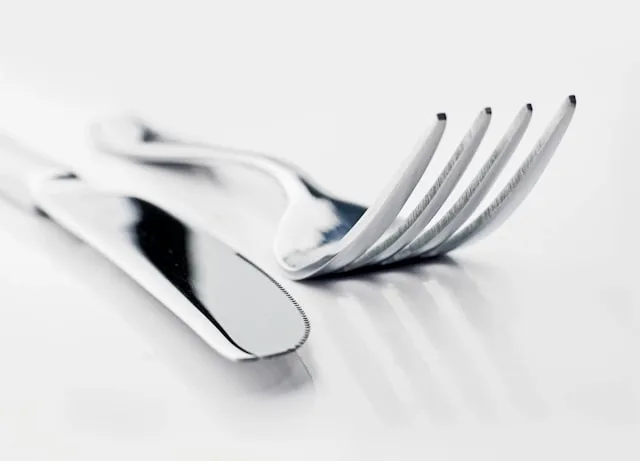 close-up of a knife and fork for how to set a table
