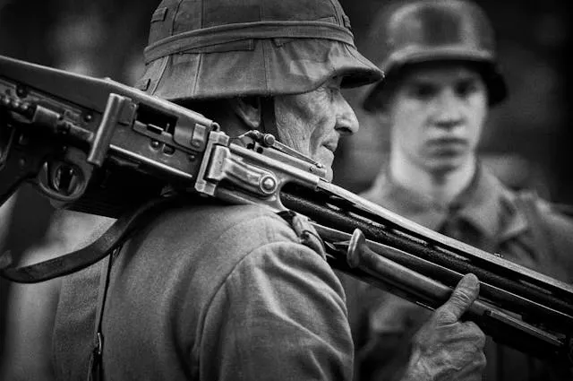 grayscale photo of a man holding a rifle for wwi patches identification