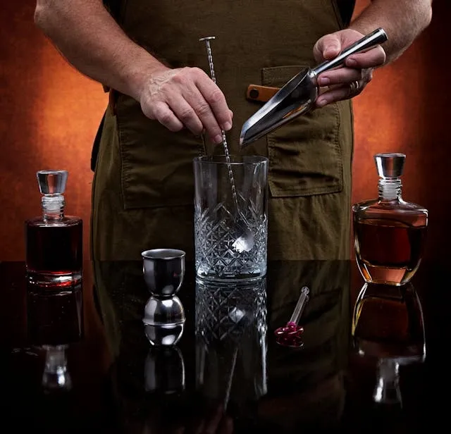 a bartender holding bar tools for best barware gifts