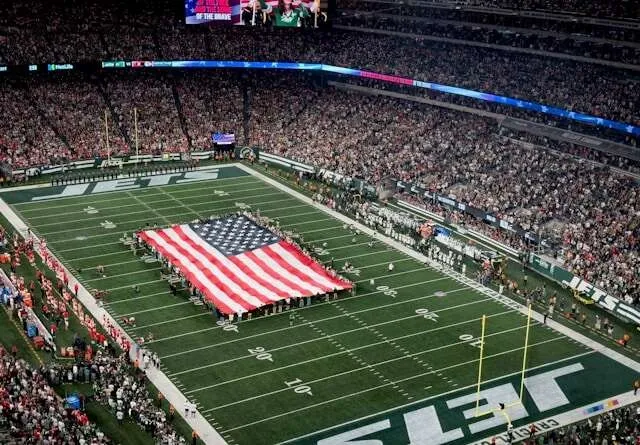 a giant us flag at a football stadium for nfl c patch
