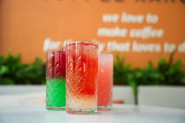 vibrant summer cocktails on a white table for what is barware