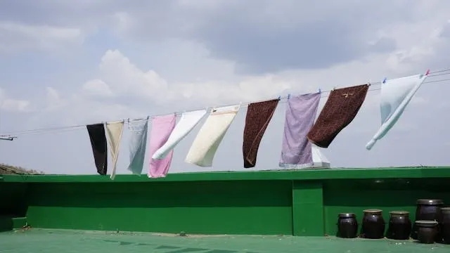 towels hanging on a clothesline for can you wash towels with clothes