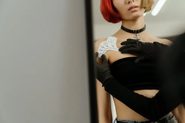 a woman looking at temporary tattoos for are temporary tattoos safe