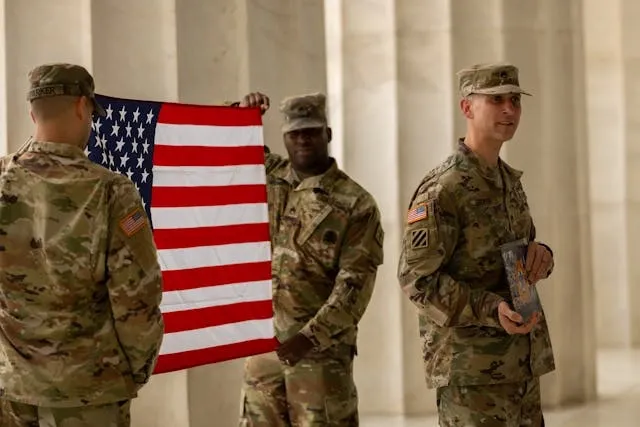 soldiers in uniforms holding the american flag for usmc red patch