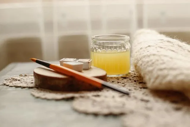 a still life with art supplies and coasters for diy fabric coasters