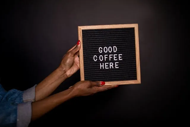 a small sign that says good coffee here for sign ideas for business