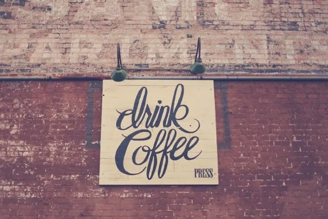 a wall sign that says drink coffee for sign ideas for business