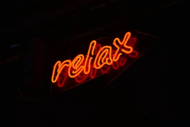 a red neon sign against a dark background for how to make LED neon signs