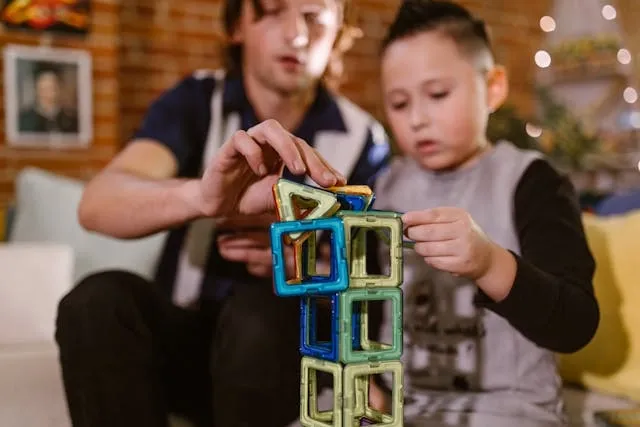a parent and child playing with magnetic toys for what to do if child swallowed small magnet