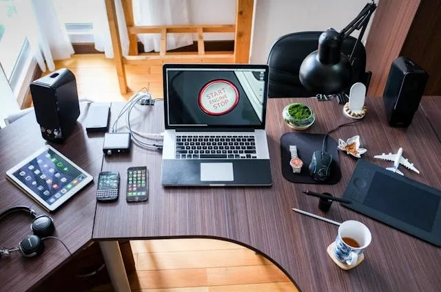 a laptop on a wooden desk for can you wash mouse pads