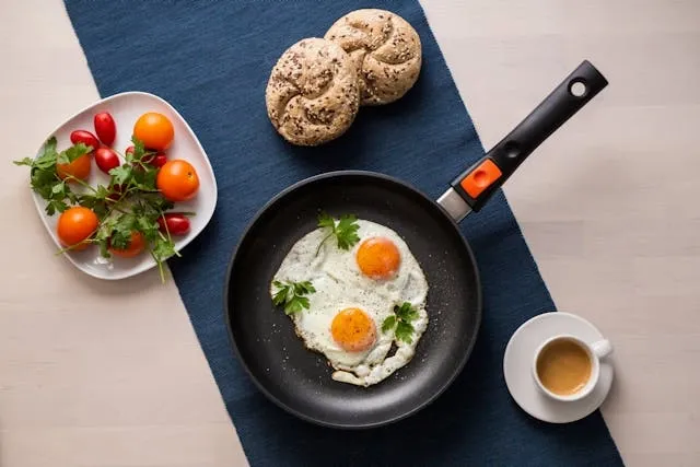 a top view of eggs on a drying pan and other foods for how to make a table runner