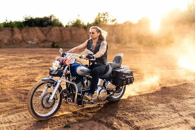 a tattooed man riding a motorcycle for bandidos patch meanings