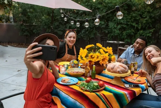 friends at a party in a yard for summer birthday party ideas