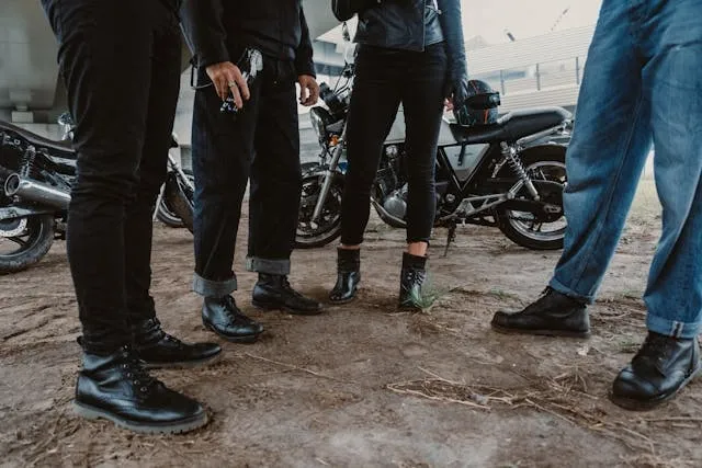 people wearing black leather boots near parked motorcycles for mongols mc patches meaning