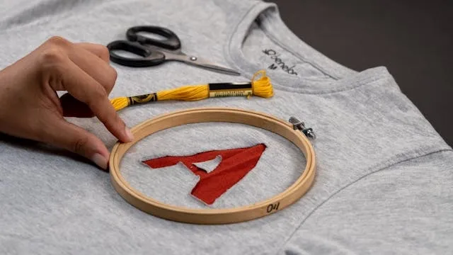 someone preparing to embroider a sweatshirt for embroidered sweatshirt ideas