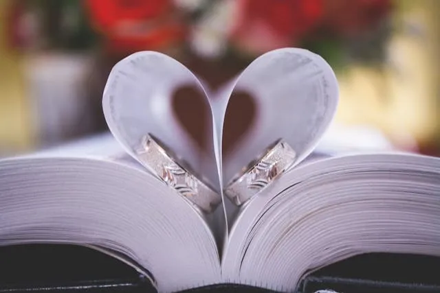 two rings on an opened book for engagement party ideas at home