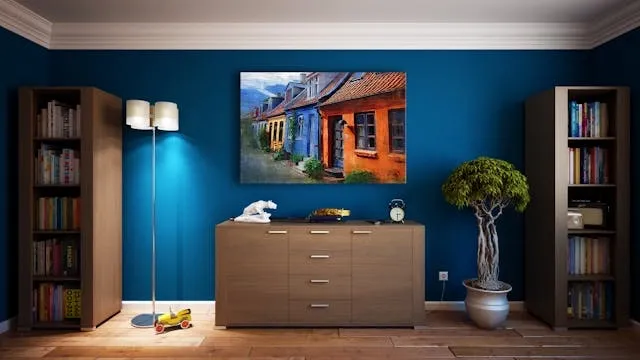 a gray wooden sideboard and a blue wall for living room wall decor ideas