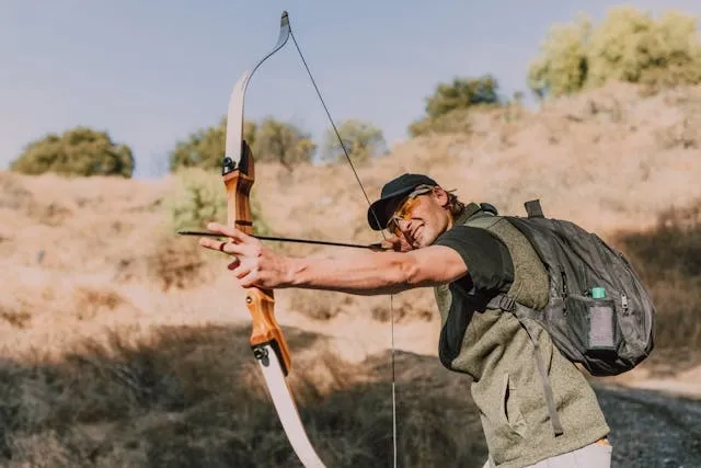 a person using a longbow for how much weight can a backpack hold
