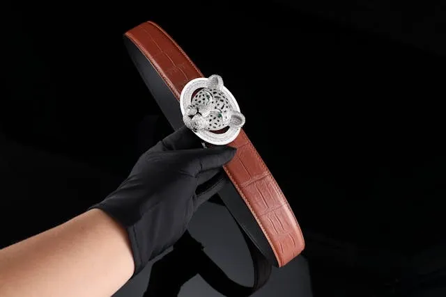 a luxury brown leather belt with an ornate panther buckle for how to put on a belt buckle