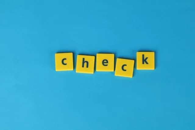 yellow letter tiles on a blue background for best pen to prevent check washing