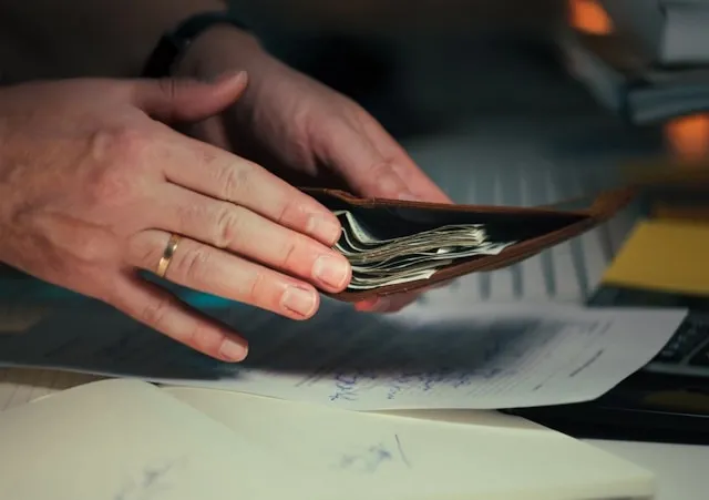 a person looking at financial paperwork for best pen to prevent check washing
