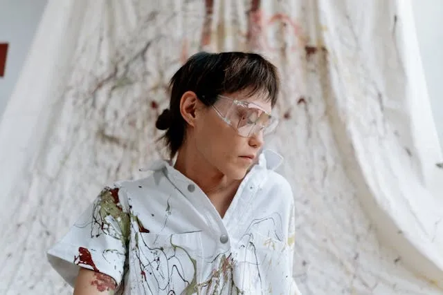 a person wearing goggles with stains on their shirt for how to get gel ink out of clothes