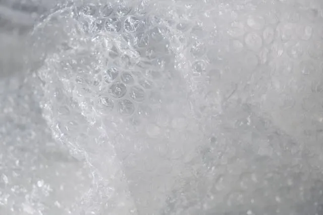 a close-up of bubble wrap for how much does a bubble mailer weigh