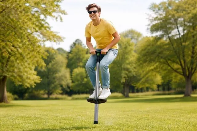 a person bouncing on a pogo stick in a field for where does a spring in a ball point pen or a pogo stick get its energy