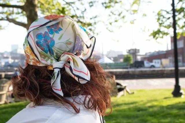 a rear view of a headscarf tied on hair for how to tie a scarf on your head