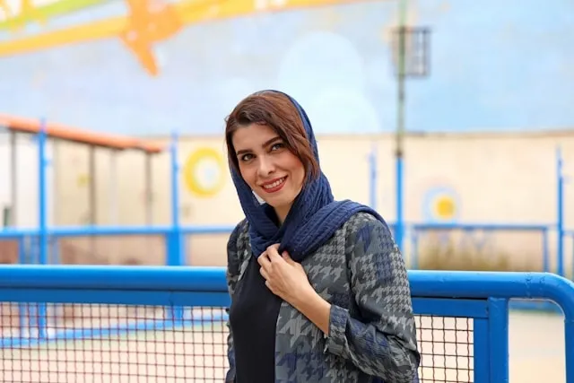 a person wearing a headscarf for how to tie a scarf on your head