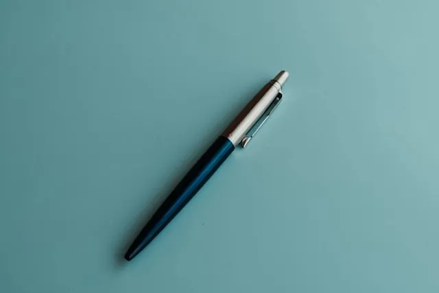 a retractable pen against a blue backdrop for where does a spring in a ball point pen or a pogo stick get its energy