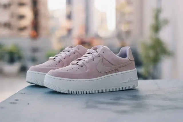 a pair of pink sneakers outdoors for how to customize air force 1