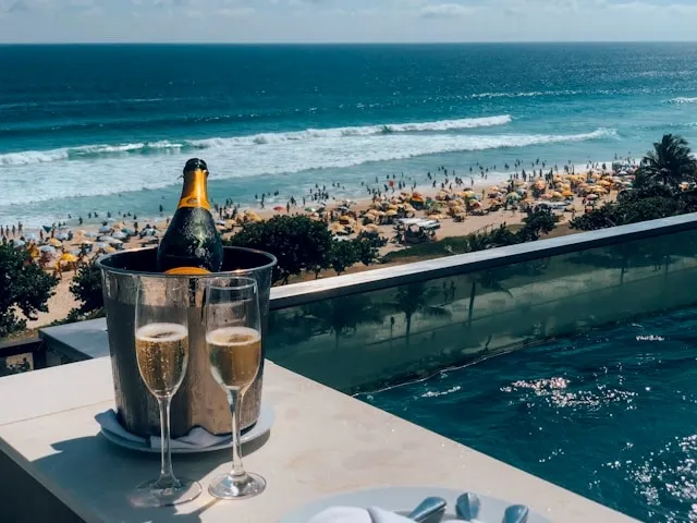 champagne and a private pool beside a beach for gifts for champagne lovers