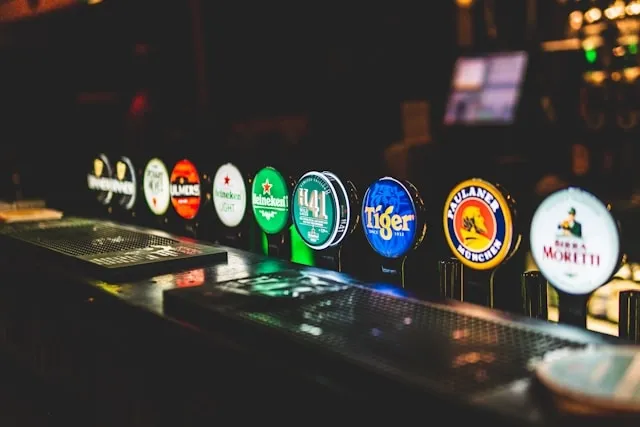 beers on tap at a bar for pub decor ideas