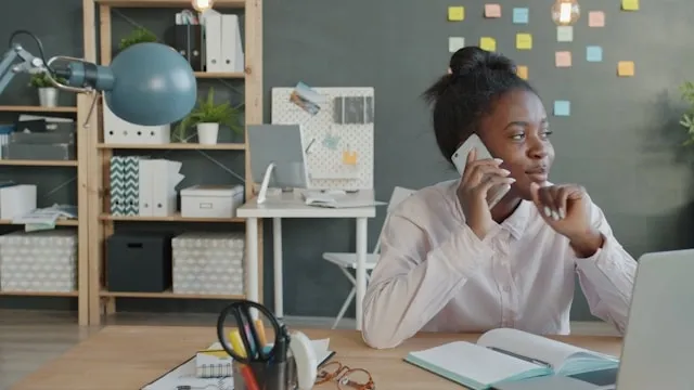 a person sits at a work desk for what is a padfolio