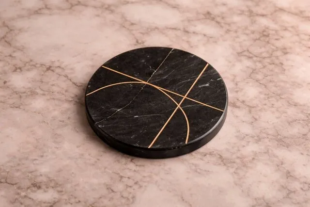 an engraved marble coaster on a countertop for do marble coasters absorb water