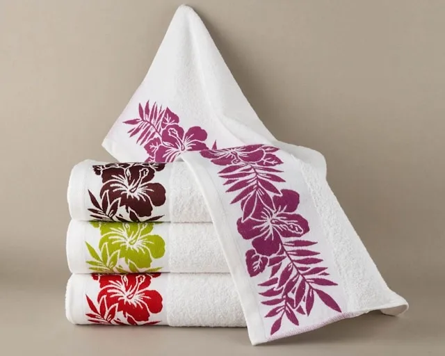 neatly folded decorative towels for how to display towels in bathroom