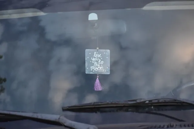 an air freshener seen through a windshield for how to make custom air fresheners