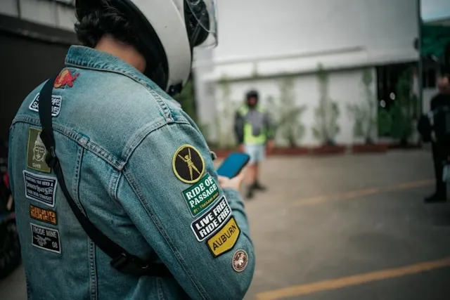 a person with multiple patches on a denim jacket for where to put patches