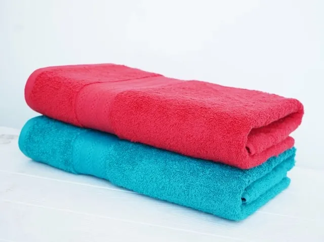 towels neatly folded and stacked for how to soften towels