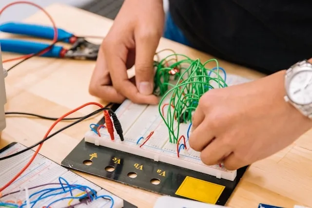 an electrician working on wiring for how to fix neon sign
