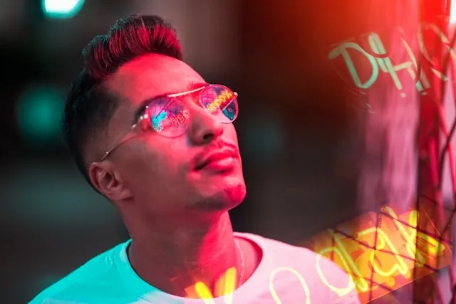 a person looking at neon signs for neon light photography