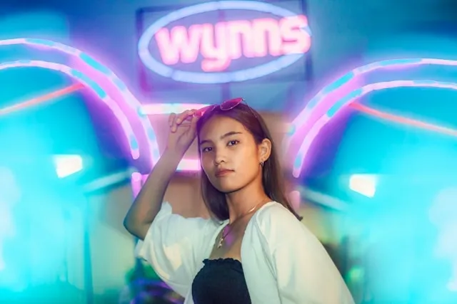 a person against a neon backdrop for neon light photography