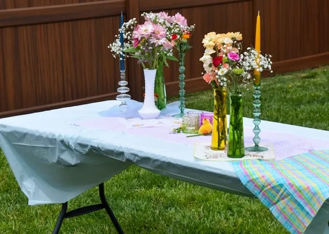 an outdoor table with plastic tablecloth for how to decorate with plastic tablecloths