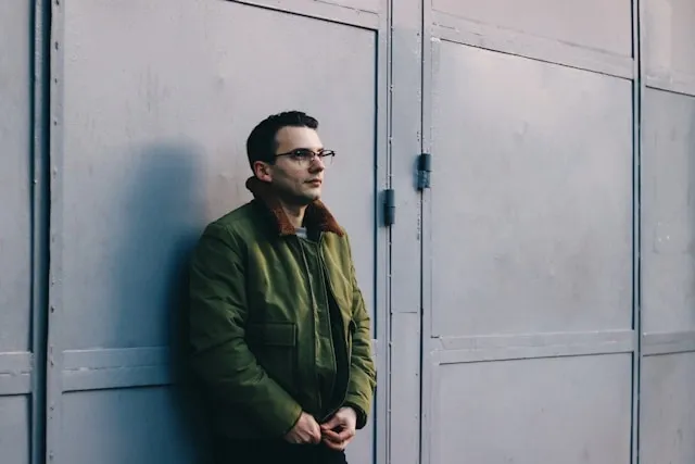 a person wearing a flight jacket for how to style a military jacket