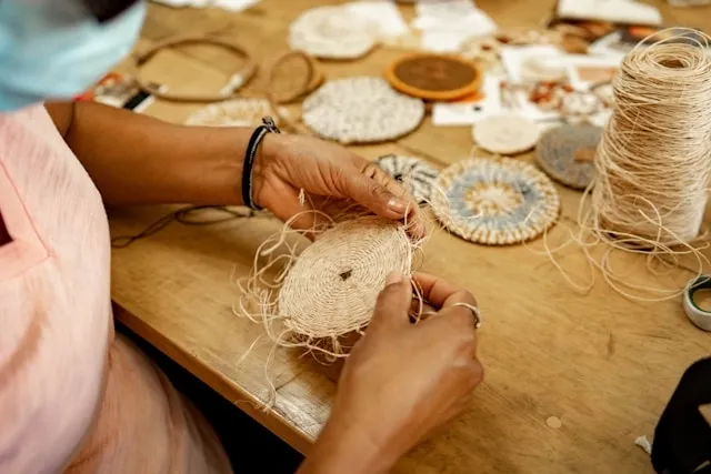 someone making a coaster by hand for diy coaster ideas